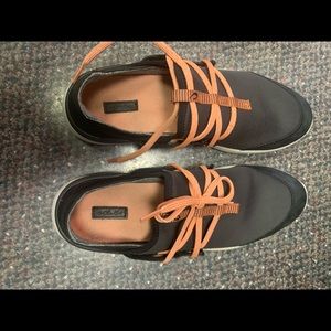 Olukai tennis shoes.